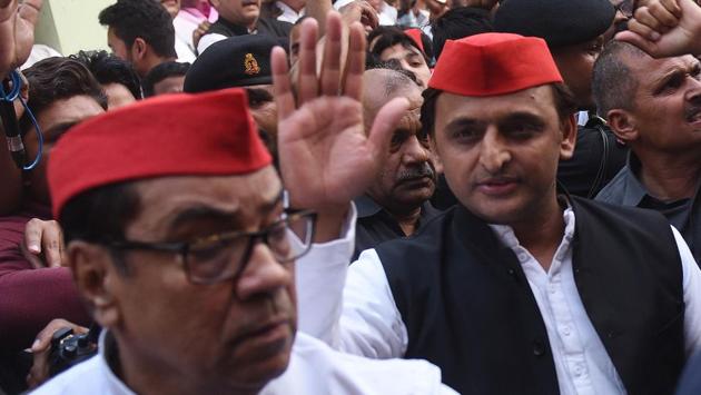 Samajwadi Party chief Akhilesh Yadav with senior party leader Kiranmoy Nanda arrives at his party office in Lucknow, India, on Wednesday , March 14, 2018.(Subhankar Chakraborty/ Hindustan Times)