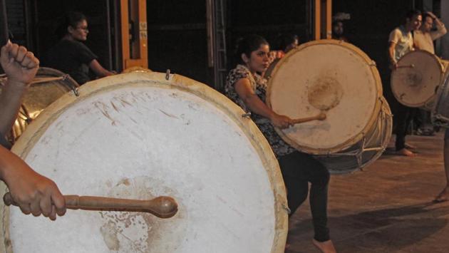 Both men and women play the drums, and there is no age or gender restriction in these groups. (Hemanshi Kamani/HT PHOTO) 