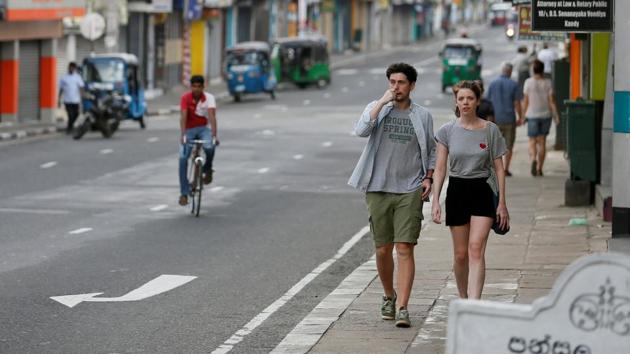Tourists walk along a street in Kandy, Sri Lanka. (Reuters File Photo)