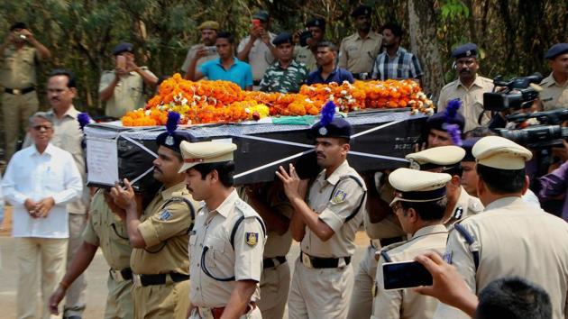 CRPF personnel carry a coffin containing the mortal remains of CRPF constable Manoranjan Lenka, who was killed in an IED explosion at Sukma district allegedly triggered by Maoists, in Bhubaneswar on Wednesday.(PTI)