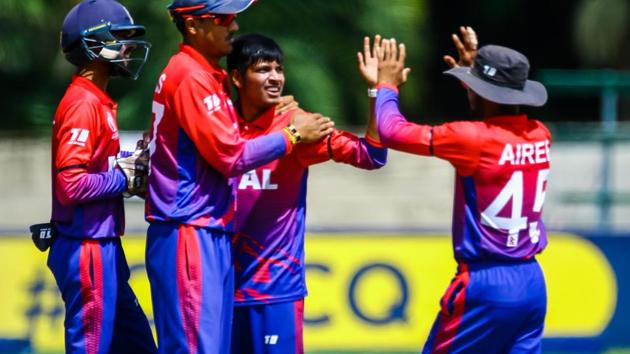 Sandeep Lamichhane celebrates after taking a wicket against Papua New Guinea. (ICC)