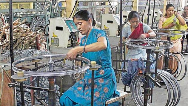 Workers on the job at one of Ludhiana’s many cycle manufacturing units, which form a big part of the state’s industry. (HT File) Workers on the job at one of Ludhiana’s many cycle manufacturing units, which form a big part of the state’s industry. (HT File)