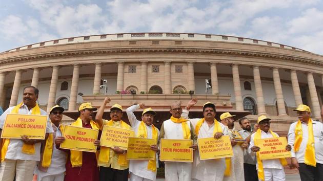 TDP leaders hold placards and shout slogans demanding special status for Andhra Pradesh, during the ongoing budget session at Parliament House in New Delhi. (PTI Photo) TDP leaders hold placards and shout slogans demanding special status for Andhra Pradesh, during the ongoing budget session at Parliament House in New Delhi. (PTI Photo)