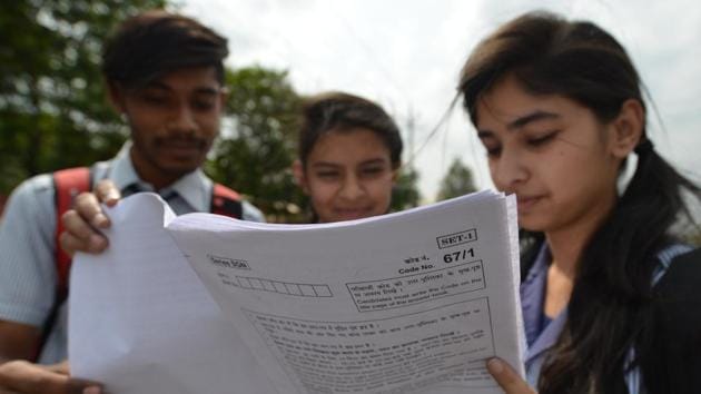 Class 12 students of Carmel convent school checking their accountancy paper after appearing in CBSE exam in Bhopal on Thursday. (Mujeeb Faruqui/HT Photo) Class 12 students of Carmel convent school checking their accountancy paper after appearing in CBSE exam in Bhopal on Thursday. (Mujeeb Faruqui/HT Photo)