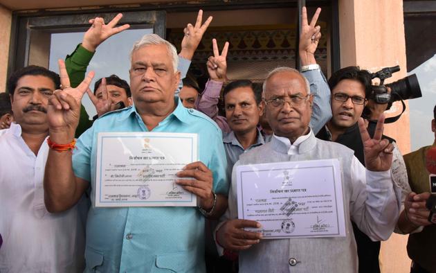 Dr Kirori Lal Meena and Madanlal Saini with winners’ certificates in Jaipur on Thursday after they were elected unopposed to the Rajya Sabha. Bhupender Yadav (not in frame) was also declared unopposed, said Rajasthan assembly secretary Prithvi Raj. (HT Photo) Dr Kirori Lal Meena and Madanlal Saini with winners’ certificates in Jaipur on Thursday after they were elected unopposed to the Rajya Sabha. Bhupender Yadav (not in frame) was also declared unopposed, said Rajasthan assembly secretary Prithvi Raj. (HT Photo)