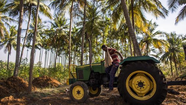 A farmer prepares to jump from a John Deere tractor, manufactured by Deere & Co., in the village of Kuragunda in Karnataka, India. After sweeping to victory with the help of the rural vote, Modi’s popularity has taken a knock as farming incomes slumped, debts piled up, joblessness rose and suicides climbed. (Prashanth Vishwanathan/Bloomberg) A farmer prepares to jump from a John Deere tractor, manufactured by Deere & Co., in the village of Kuragunda in Karnataka, India. After sweeping to victory with the help of the rural vote, Modi’s popularity has taken a knock as farming incomes slumped, debts piled up, joblessness rose and suicides climbed. (Prashanth Vishwanathan/Bloomberg)