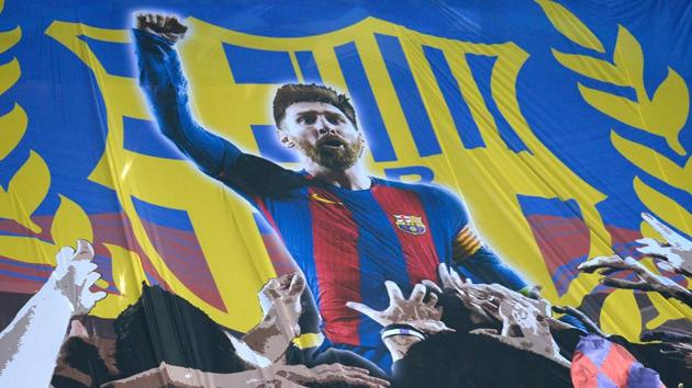 Barcelona supporters hold a giant banner depicting Lionel Messi during the UEFA Champions League round of 16 second leg against Chelsea in Camp Nou. (AFP)
