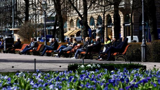 People enjoy a sunnny day at the Esplanade in Helsinki, Finland. The country has topped the UN’s happiness rankings(REUTERS File) People enjoy a sunnny day at the Esplanade in Helsinki, Finland. The country has topped the UN’s happiness rankings(REUTERS File)
