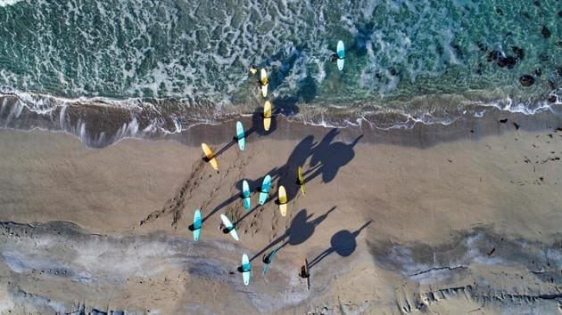 Surfers attend a a surfing course in Norway. While surfing began in Norway in 1960’s, competitions such as the Lofoten Masters started in 2007, bringing surfers from around the world and put the islands on surfers’ radars. (Oliver Morin / AFP) Surfers attend a a surfing course in Norway. While surfing began in Norway in 1960’s, competitions such as the Lofoten Masters started in 2007, bringing surfers from around the world and put the islands on surfers’ radars. (Oliver Morin / AFP)