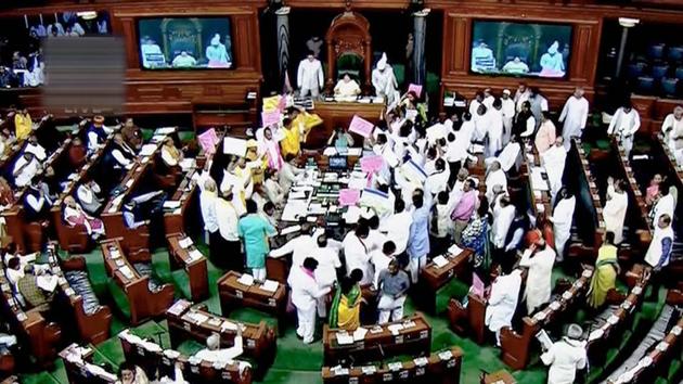 Opposition members protest during the ongoing budget session of Parliament in the Lok Sabha on Thursday. (PTI/TV Grab) Opposition members protest during the ongoing budget session of Parliament in the Lok Sabha on Thursday. (PTI/TV Grab)