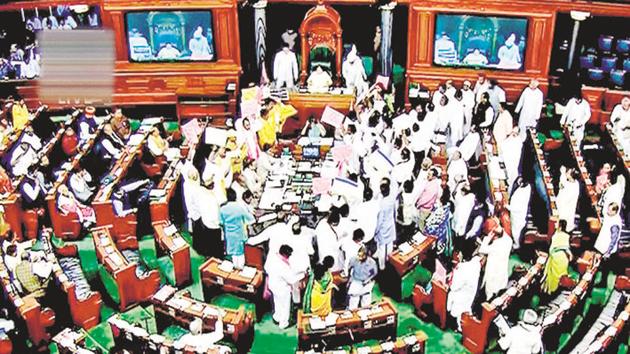 New Delhi: Opposition members protest during the ongoing budget session of Parliament in the Lok Sabha, in New Delhi, March 15 (PTI) New Delhi: Opposition members protest during the ongoing budget session of Parliament in the Lok Sabha, in New Delhi, March 15 (PTI)