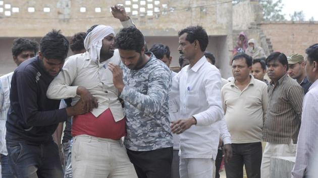 Neighbours and relatives mourn the death of the five persons. (Sunil Ghosh/HT Photo) Neighbours and relatives mourn the death of the five persons. (Sunil Ghosh/HT Photo)