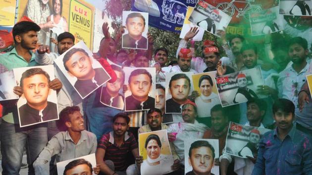 Supporters hold up photos of Samajwadi Party chief Akhilesh Yadav and Bahujan Samaj Party chief Mayawati to celebrate the their electoral victory in the Lok Sabha bypoll elections, at Lahurabir Azad Park, Varanasi on March 14, 2018. (Rajesh Kumar/HT Photo) Supporters hold up photos of Samajwadi Party chief Akhilesh Yadav and Bahujan Samaj Party chief Mayawati to celebrate the their electoral victory in the Lok Sabha bypoll elections, at Lahurabir Azad Park, Varanasi on March 14, 2018. (Rajesh Kumar/HT Photo)