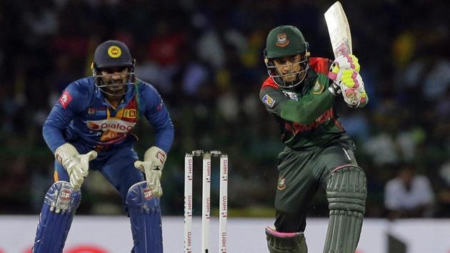 Bangladesh's Mushfiqur Rahim plays a shot as Sri Lanka's Kusal Perera watches. (AP) Bangladesh's Mushfiqur Rahim plays a shot as Sri Lanka's Kusal Perera watches. (AP)