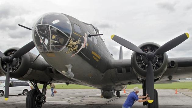 Crew chief Gary Pasco tends to Memphis Belle B-17 Flying Fortress after landing at Cleveland Hopkins International Airport.(AP)