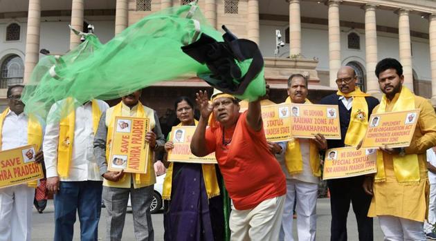 TDP MP Naramalli Sivaprasad, dressed as a fisherman, and other leaders demand special status for Andhra Pradesh at Parliament House on Friday.(PTI)
