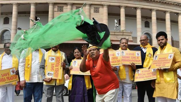 Telugu Desam Party (TDP) MP Naramalli Sivaprasad (R) and other leaders, protests demanding special status for Andhra Pradesh during the Budget Session of Parliament in New Delhi on Friday. The TDP on Friday formally decided to quit the NDA, days after two of its MPs resigned as ministers in the Narendra Modi government to protest the Centre’s refusal of Special Category Status to Andhra Pradesh. (Vijay Verma / PTI) Telugu Desam Party (TDP) MP Naramalli Sivaprasad (R) and other leaders, protests demanding special status for Andhra Pradesh during the Budget Session of Parliament in New Delhi on Friday. The TDP on Friday formally decided to quit the NDA, days after two of its MPs resigned as ministers in the Narendra Modi government to protest the Centre’s refusal of Special Category Status to Andhra Pradesh. (Vijay Verma / PTI)