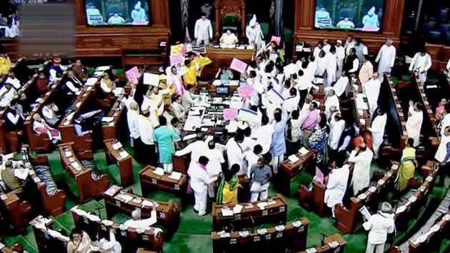 Opposition members protest during the ongoing budget session of Parliament in the Lok Sabha in New Delhi on Thursday. (PTI) Opposition members protest during the ongoing budget session of Parliament in the Lok Sabha in New Delhi on Thursday. (PTI)