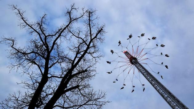 People ride a swing carousel ride at St. Matthew's fairground, a traditional amusement park, in Prague, Czech Republic. (David W Cerny / REUTERS) People ride a swing carousel ride at St. Matthew's fairground, a traditional amusement park, in Prague, Czech Republic. (David W Cerny / REUTERS)