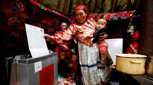 Members the Yamb To (Long Lake) community take part in early voting, at a reindeer camping ground in Nenets Autonomous District, Russia. Russia will hold a presidential election on Sunday but voting in the flat, snow-covered expanses of the Siberian Arctic, home to the nomadic Nenets people, has been underway since late February. (Sergei Karpukhin / REUTERS) Members the Yamb To (Long Lake) community take part in early voting, at a reindeer camping ground in Nenets Autonomous District, Russia. Russia will hold a presidential election on Sunday but voting in the flat, snow-covered expanses of the Siberian Arctic, home to the nomadic Nenets people, has been underway since late February. (Sergei Karpukhin / REUTERS)