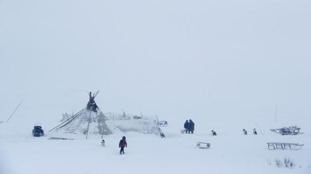 People are seen near a yurt tent at a reindeer camping ground somewhere in the Nenets Autonomous District. Kremlin politics and Moscow’s six-lane motorways feel a world away in the Nenets Autonomous Region, 1,570 km northeast of the capital, where temperatures can drop to -40 degrees Celsius. (Sergei Karpukhin / REUTERS) People are seen near a yurt tent at a reindeer camping ground somewhere in the Nenets Autonomous District. Kremlin politics and Moscow’s six-lane motorways feel a world away in the Nenets Autonomous Region, 1,570 km northeast of the capital, where temperatures can drop to -40 degrees Celsius. (Sergei Karpukhin / REUTERS)