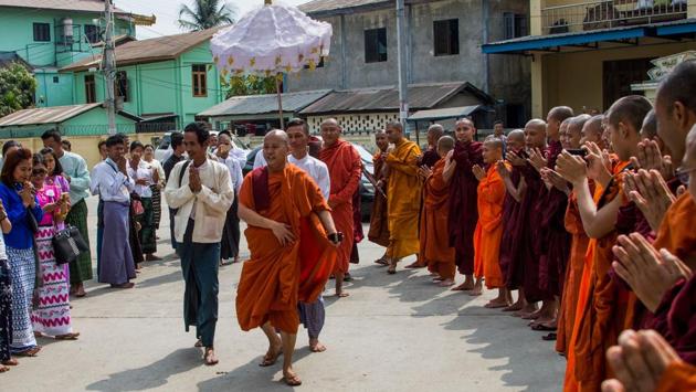 Ultra-nationalist monk Wirathu (C) arrives at a monastery in Yangon to give a sermon marking the end of a year-long ban on public speaking. Wirathu, once dubbed the “Buddhist Bin Laden”, was barred from giving public sermons last year by a council of senior monks who said he had “repeatedly delivered hate speech against religions to cause communal strife”. (Ye Aung Thu / AFP) Ultra-nationalist monk Wirathu (C) arrives at a monastery in Yangon to give a sermon marking the end of a year-long ban on public speaking. Wirathu, once dubbed the “Buddhist Bin Laden”, was barred from giving public sermons last year by a council of senior monks who said he had “repeatedly delivered hate speech against religions to cause communal strife”. (Ye Aung Thu / AFP)