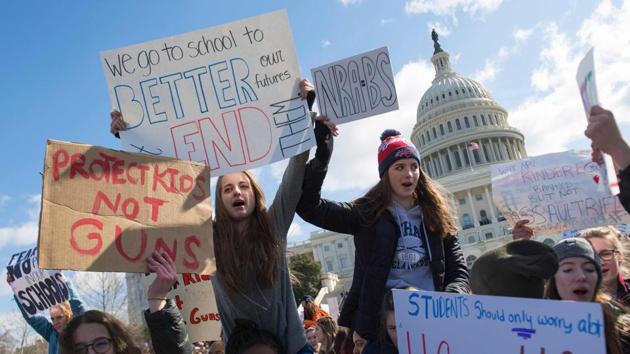 Students participate in a rally with other students from DC, Maryland and Virginia in their Solidarity Walk-Out to urge Republican leaders in Congress “to allow votes on gun violence prevention legislation.” on Capitol Hill in Washington, DC. (Jim Watson / AFP) Students participate in a rally with other students from DC, Maryland and Virginia in their Solidarity Walk-Out to urge Republican leaders in Congress “to allow votes on gun violence prevention legislation.” on Capitol Hill in Washington, DC. (Jim Watson / AFP)