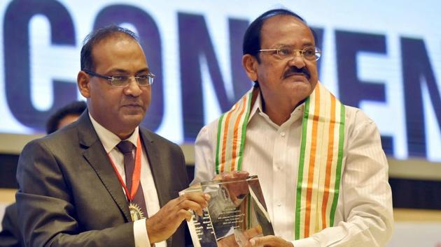 Vice President M Venkaiah Naidu being presented a memento by CMA Sanjay Gupta during the 58th National Coast Convention 2018 at Vigyan Bhavan in New Delhi. (PTI Photo) Vice President M Venkaiah Naidu being presented a memento by CMA Sanjay Gupta during the 58th National Coast Convention 2018 at Vigyan Bhavan in New Delhi. (PTI Photo)