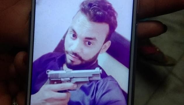 Vijay Singh (23), a resident of Vijay Vihar, was found dead with a gunshot wound to the back of his neck on Thursday night. (HT Photos) Vijay Singh (23), a resident of Vijay Vihar, was found dead with a gunshot wound to the back of his neck on Thursday night. (HT Photos)