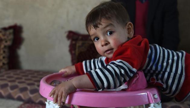 This picture taken on March 16, 2018 shows Afghan toddler Donald Trump, who is aged around 18 months, playing at his home in Kabul.(AFP)