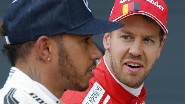 Lewis Hamilton and Sebastian Vettel start the Formula One season within touching distance of further greatness. A fifth world title would move one of them level with Juan Manuel Fangio and second only to Michael Schumacher’s seven. (AP) Lewis Hamilton and Sebastian Vettel start the Formula One season within touching distance of further greatness. A fifth world title would move one of them level with Juan Manuel Fangio and second only to Michael Schumacher’s seven. (AP)