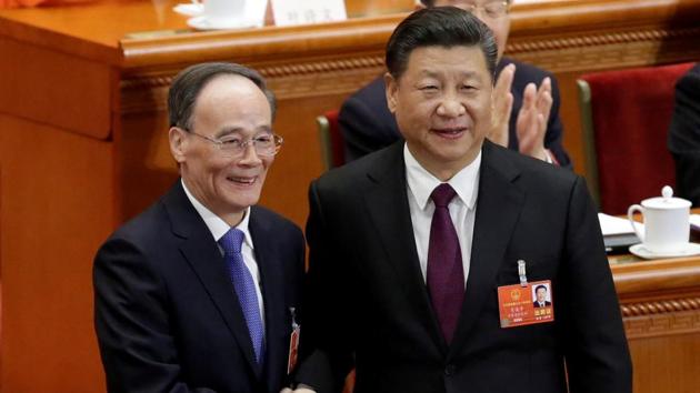 Chinese President Xi Jinping (R) shakes hands with newly elected Chinese Vice President Wang Qishan at the fifth plenary session of the National People's Congress (NPC) at the Great Hall of the People in Beijing, China March 17, 2018. (Reuters Photo) Chinese President Xi Jinping (R) shakes hands with newly elected Chinese Vice President Wang Qishan at the fifth plenary session of the National People's Congress (NPC) at the Great Hall of the People in Beijing, China March 17, 2018. (Reuters Photo)