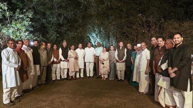 United Progressive Alliance (UPA) Chairperson Sonia Gandhi (C) with Opposition party leaders pose for a group photograph at a dinner hosted at her residence in New Delhi on March 13. (PTI) United Progressive Alliance (UPA) Chairperson Sonia Gandhi (C) with Opposition party leaders pose for a group photograph at a dinner hosted at her residence in New Delhi on March 13. (PTI)