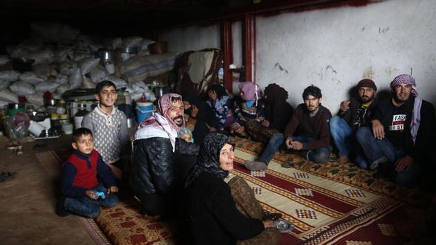 People take cover in a cellar in the village of Qastal Koshk, north of Afrin on March 16, 2018, amid battles between Turkish-backed forces and Kurdish fighters.(AFP Photo) People take cover in a cellar in the village of Qastal Koshk, north of Afrin on March 16, 2018, amid battles between Turkish-backed forces and Kurdish fighters.(AFP Photo)