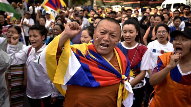 Tibetan people gather for a peaceful protest against Chinese government during the 10th Anniversary of Tibetan Uprising at Parliament Street near Jantar Mantar on March 14. (Raj K Raj / HT Photo) Tibetan people gather for a peaceful protest against Chinese government during the 10th Anniversary of Tibetan Uprising at Parliament Street near Jantar Mantar on March 14. (Raj K Raj / HT Photo)