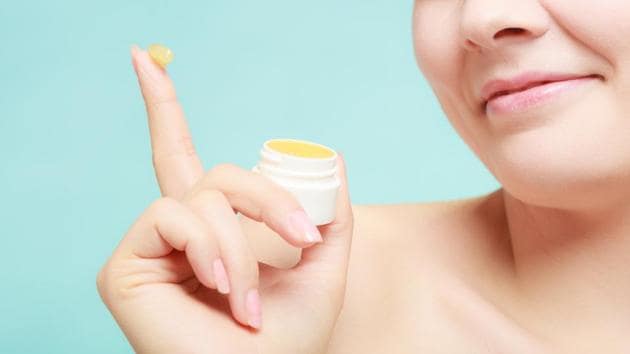 Apply a thin layer of a multipurpose organic balm, then use a soft toothbrush to gently scrub the dead skin off. (Getty Images/iStockphoto)
