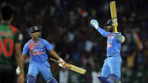 India's Dinesh Karthik, right, celebrates after scoring the winning run in the Nidahas Trophy T20 final match to defeat Bangladesh. (AP) India's Dinesh Karthik, right, celebrates after scoring the winning run in the Nidahas Trophy T20 final match to defeat Bangladesh. (AP)