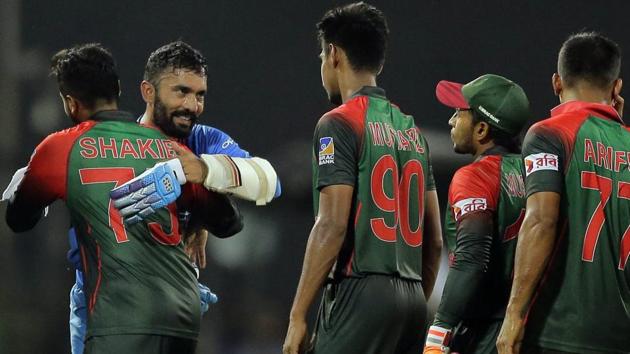 Bangladesh cricketers congratulate India's Dinesh Karthik after the Nidahas Trophy T20 final match. (AP) Bangladesh cricketers congratulate India's Dinesh Karthik after the Nidahas Trophy T20 final match. (AP)