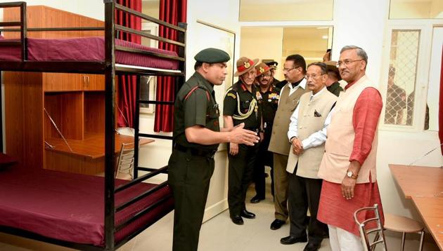 Army Chief Bipin Rawat (second from left) with Uttarakhand chief minister TrivendraSingh Rawat at the inauguration of Garhwal Rifles War Memorial Boys and Girls Hostel in Dehradun on Sunday.(PTI)