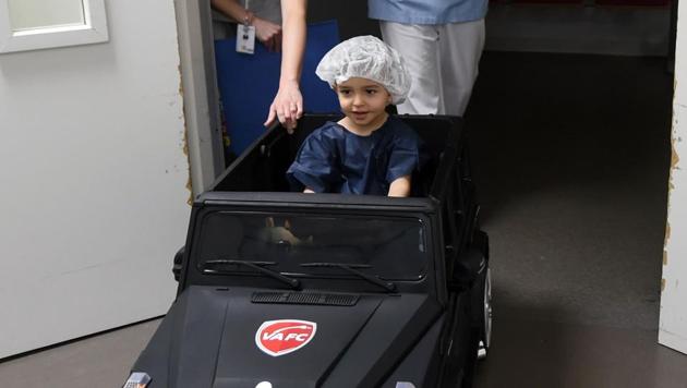 Two-year-old Souhail sits in an electric toy car on his way to the operating room at the Valenciennes Hospital in Valenciennes, northern France. (AFP) Two-year-old Souhail sits in an electric toy car on his way to the operating room at the Valenciennes Hospital in Valenciennes, northern France. (AFP)