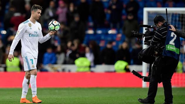 Real Madrid's Portuguese forward Cristiano Ronaldo takes the ball at the end of the La Liga game against Girona FC at the Santiago Bernabeu stadium in Madrid on Sunday.(AFP)