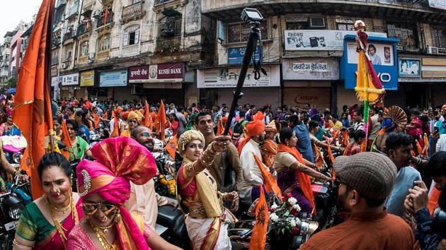 Around 10,000 people participated in the Girgaum rally, including 120 women on motorbikes. The rally started at the Phadke Wadi Ganesh Mandir and went up to Princess Street. (Pratik Chorge/HT Photo) 
