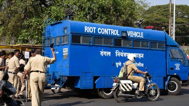 A riot control vehicle arrived at the Shivajinagar court as attempt was made to throw ink on Milind Ekbote when he was presented before a court in Pune on Monday. (SANKET WANKHADE/HT PHOTO) A riot control vehicle arrived at the Shivajinagar court as attempt was made to throw ink on Milind Ekbote when he was presented before a court in Pune on Monday. (SANKET WANKHADE/HT PHOTO)