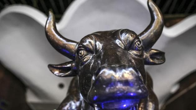A bronze bull statue stands at the entrance to the Bombay Stock Exchange (BSE) building in Mumbai, India.