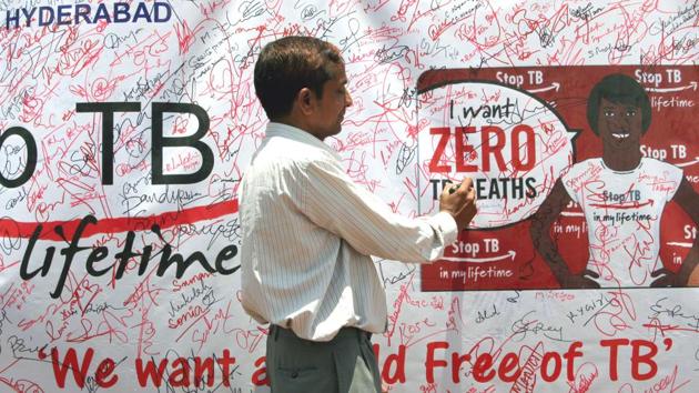 A volunteer signing the signature campaign poster during an awareness programme for eradication of tuberculosis in India(Getty Images)