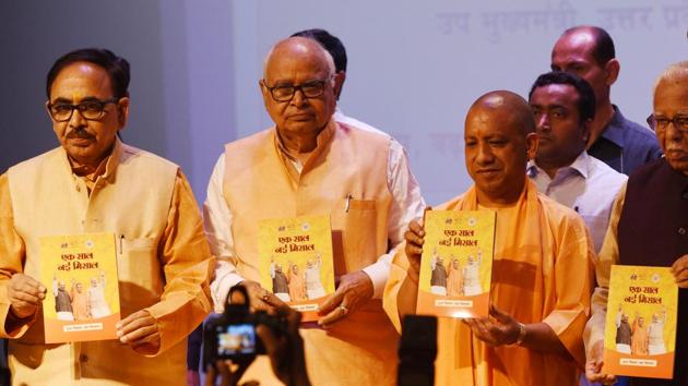 Uttar Pradesh chief minister Yogi Adityanath releases a booklet on the completion of one year of BJP government in Uttar Pradesh at Lok Bhavan in Lucknow on Monday. (Subhankar Chakraborty/HT Photo) Uttar Pradesh chief minister Yogi Adityanath releases a booklet on the completion of one year of BJP government in Uttar Pradesh at Lok Bhavan in Lucknow on Monday. (Subhankar Chakraborty/HT Photo)