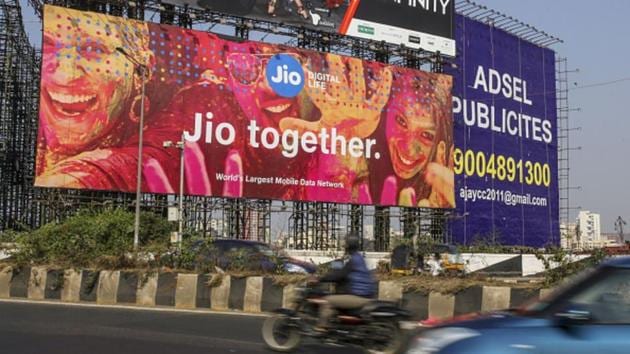 Traffic travels past a billboard for Reliance Jio Infocomm Ltd. in the Bandra area of Mumbai, India. (Bloomberg via Getty Images) Traffic travels past a billboard for Reliance Jio Infocomm Ltd. in the Bandra area of Mumbai, India. (Bloomberg via Getty Images)
