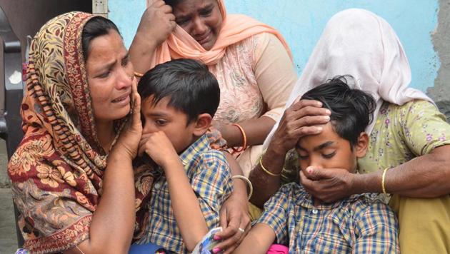 Seema (left), her sons Karan (centre) and Arjun and her mother in-law Jeeto (right) react following confirmation by external affairs minister Sushma Swaraj that her husband Sonu had been killed in Iraq. The family lives in Chawinda Devi village, some 22 kilometres from Amritsar. (Sameer Sehgal/HT) Seema (left), her sons Karan (centre) and Arjun and her mother in-law Jeeto (right) react following confirmation by external affairs minister Sushma Swaraj that her husband Sonu had been killed in Iraq. The family lives in Chawinda Devi village, some 22 kilometres from Amritsar. (Sameer Sehgal/HT)