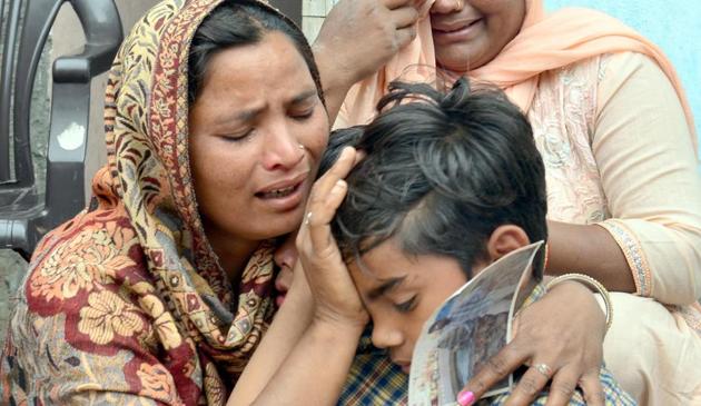 Seema (left) and her sons Karan react following confirmation by external affairs minister Sushma Swaraj that her husband Sonu had been killed in Iraq. The family lives in Chawinda Devi village, some 22 kilometres from Amritsar. (Sameer Sehgal/HT) Seema (left) and her sons Karan react following confirmation by external affairs minister Sushma Swaraj that her husband Sonu had been killed in Iraq. The family lives in Chawinda Devi village, some 22 kilometres from Amritsar. (Sameer Sehgal/HT)