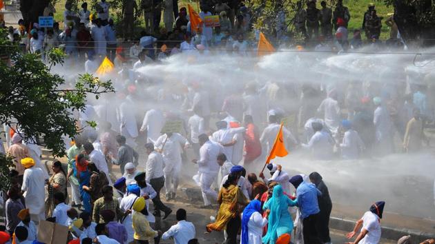 Police use water canons on Shiromani Akali Dal (SAD) workers during their bid to gherao the Punjab Assembly in Chandigarh. The Chandigarh police also detained SAD chief Sukhbir Badal, minister of state for social justice and empowerment Vijay Sampla and Akali leader Bikram Majithia while SAD-BJP workers tried to break barricades. (Ravi Kumar / HT Photo) Police use water canons on Shiromani Akali Dal (SAD) workers during their bid to gherao the Punjab Assembly in Chandigarh. The Chandigarh police also detained SAD chief Sukhbir Badal, minister of state for social justice and empowerment Vijay Sampla and Akali leader Bikram Majithia while SAD-BJP workers tried to break barricades. (Ravi Kumar / HT Photo)